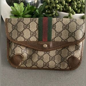 Authentic vintage Gucci mini clutch bag 8 inches across 5 inches in length.